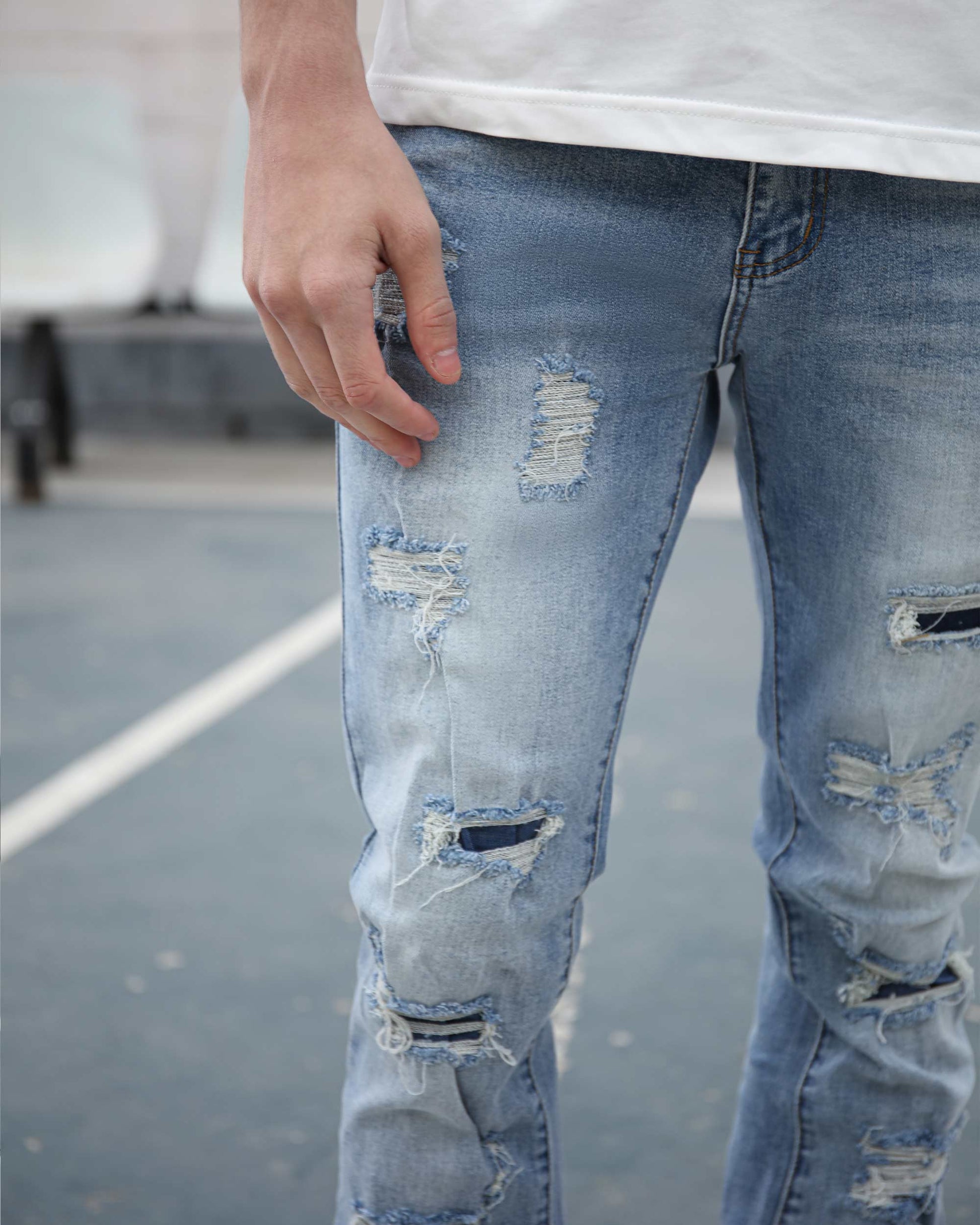 Logeqi light wash ripped jeans featuring distressed design and modern fit for casual style