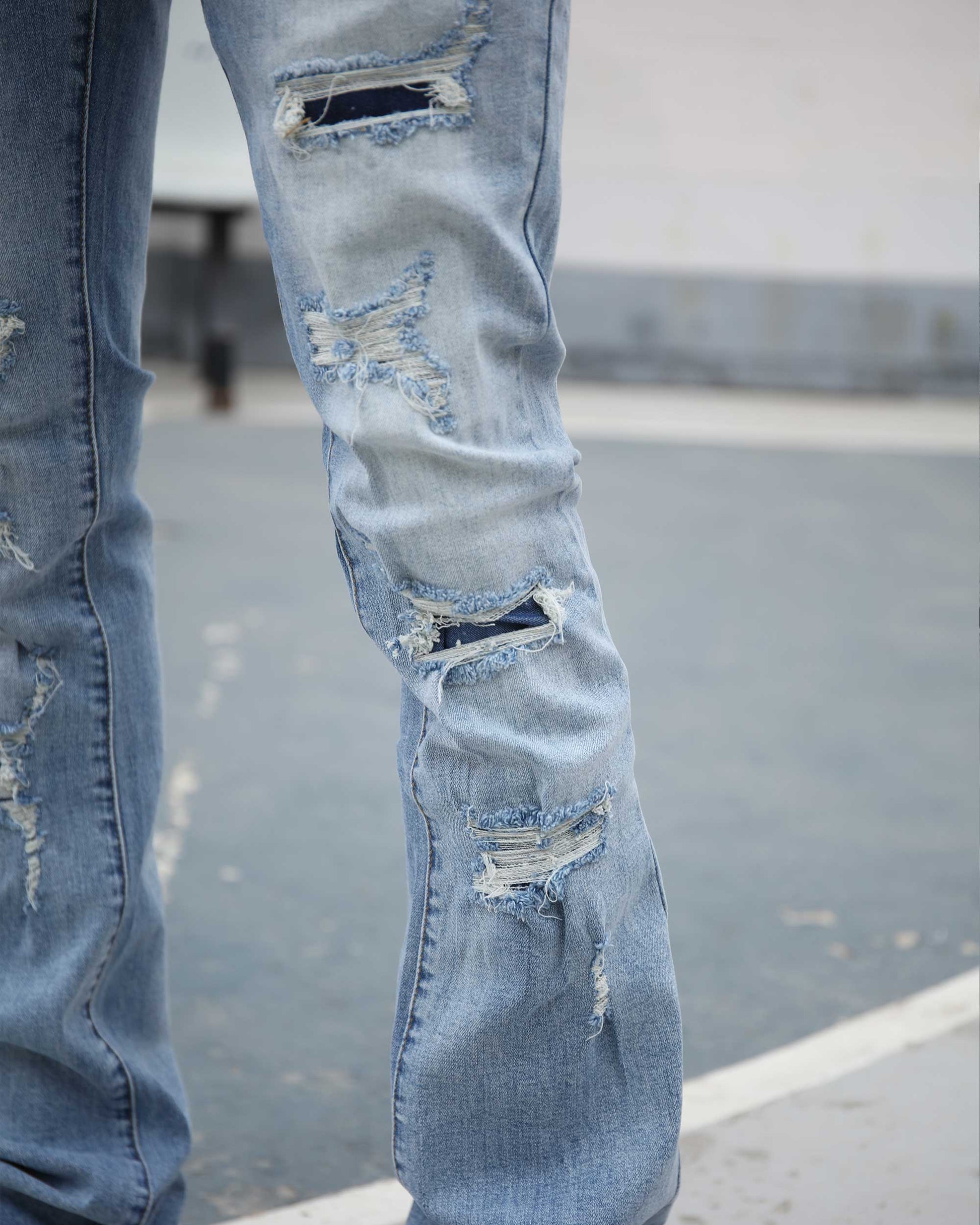 Logeqi light wash ripped jeans featuring distressed detailing on the legs for a trendy casual look