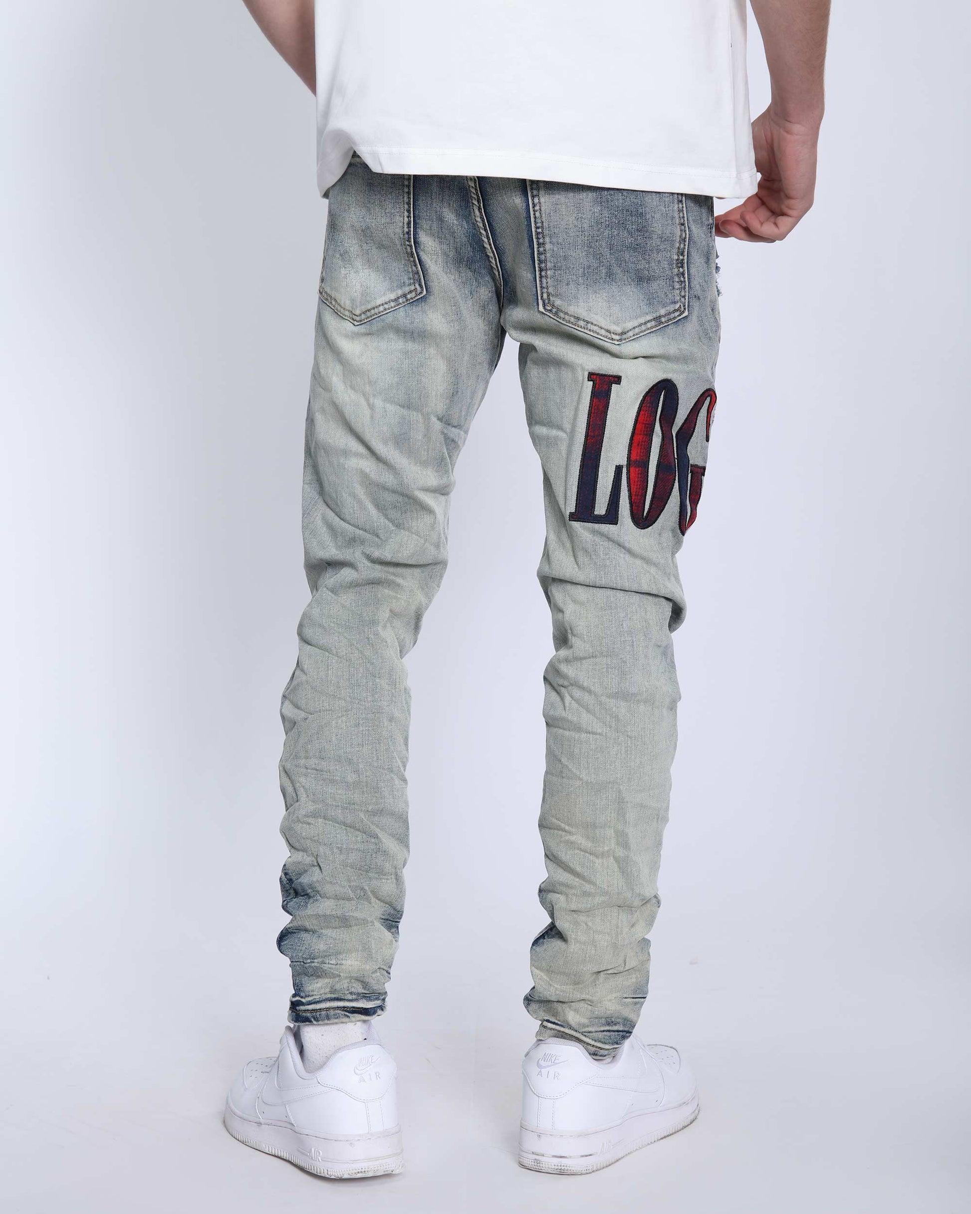 Logeqi light washed ripped jeans featuring distressed detailing and a cool graphic design