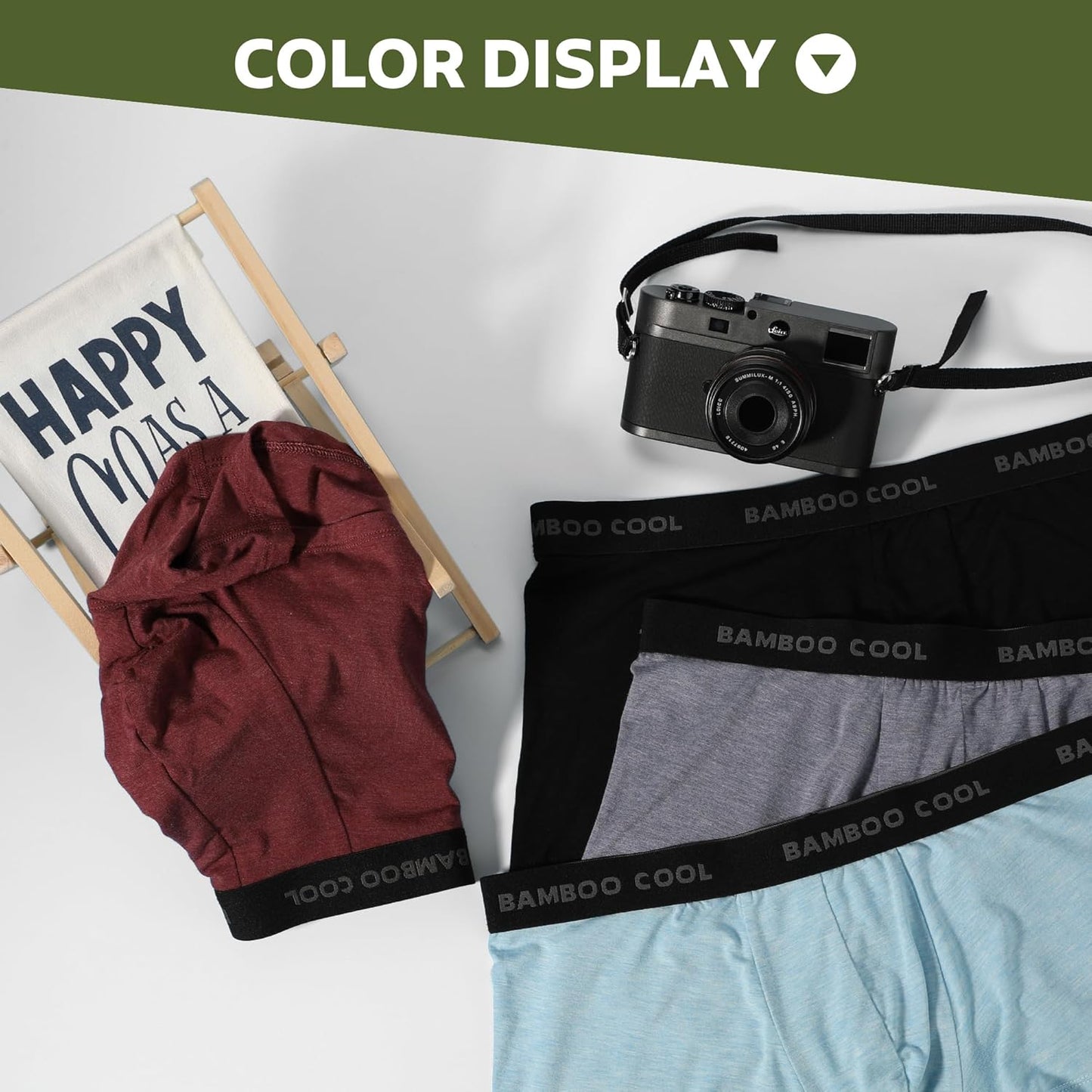 Collection of men's bamboo boxer briefs in various colors with a camera and display sign