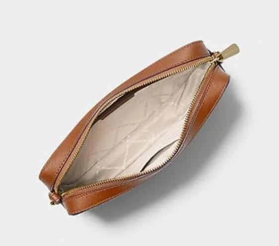 Michael Kors vanilla crossbody bag with a spacious interior featuring a quilted lining