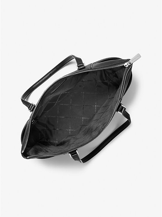 Open view of Michael Kors Charlotte Saffiano leather handbag showcasing spacious interior and zipper detail