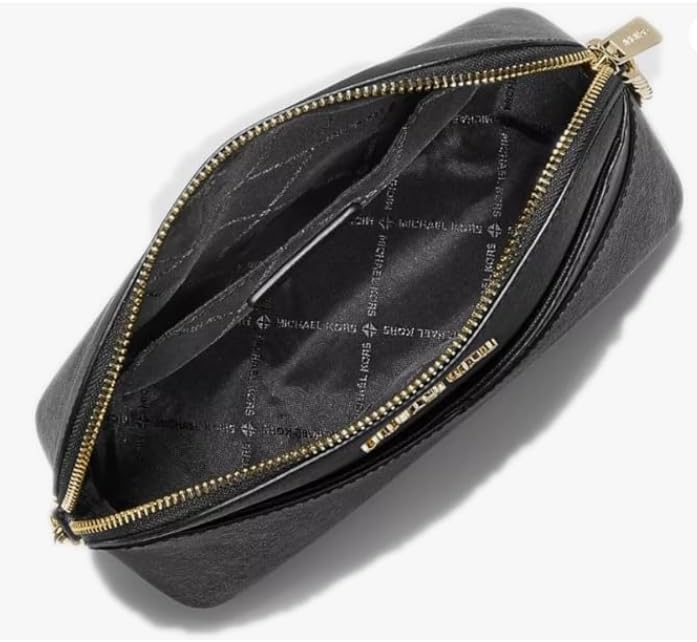 Interior view of a Michael Kors crossbody bag showing spacious black lining and zip closure