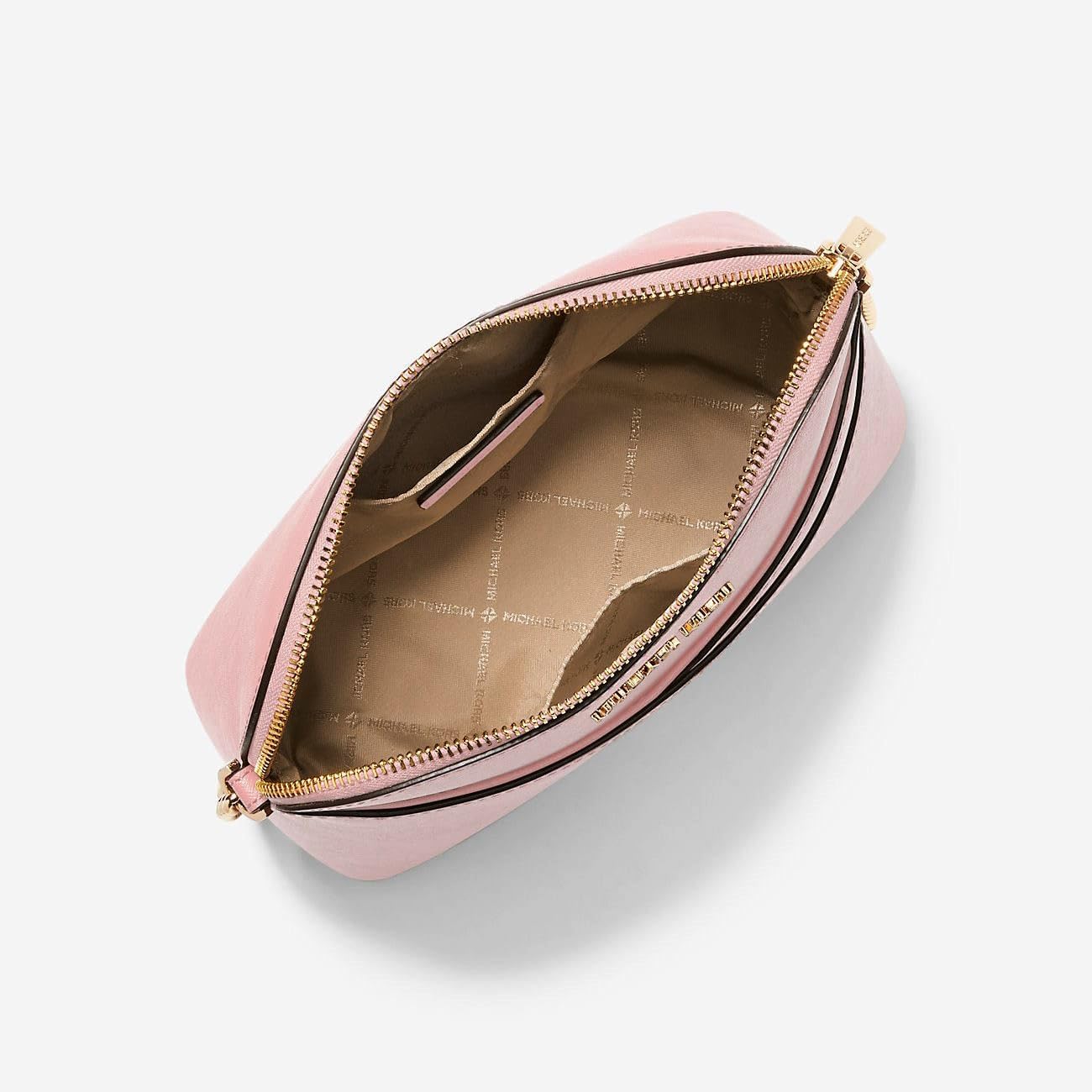 Interior view of a Michael Kors crossbody leather handbag in pink with organized compartments