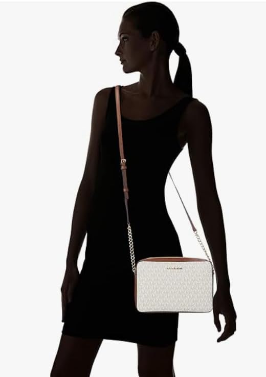 Stylish model showcasing a Michael Kors vanilla crossbody bag with elegant design for casual outings