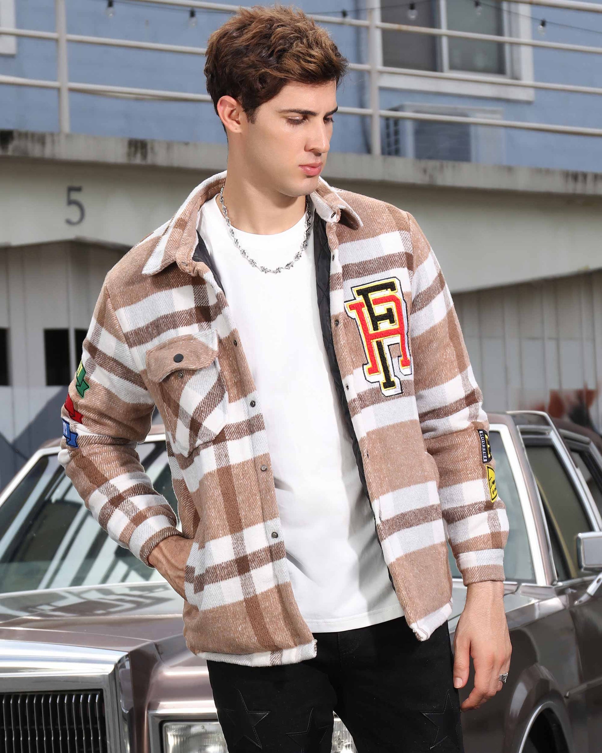 Logeqi modern plaid moto jacket in brown and white plaid with patches worn by male model