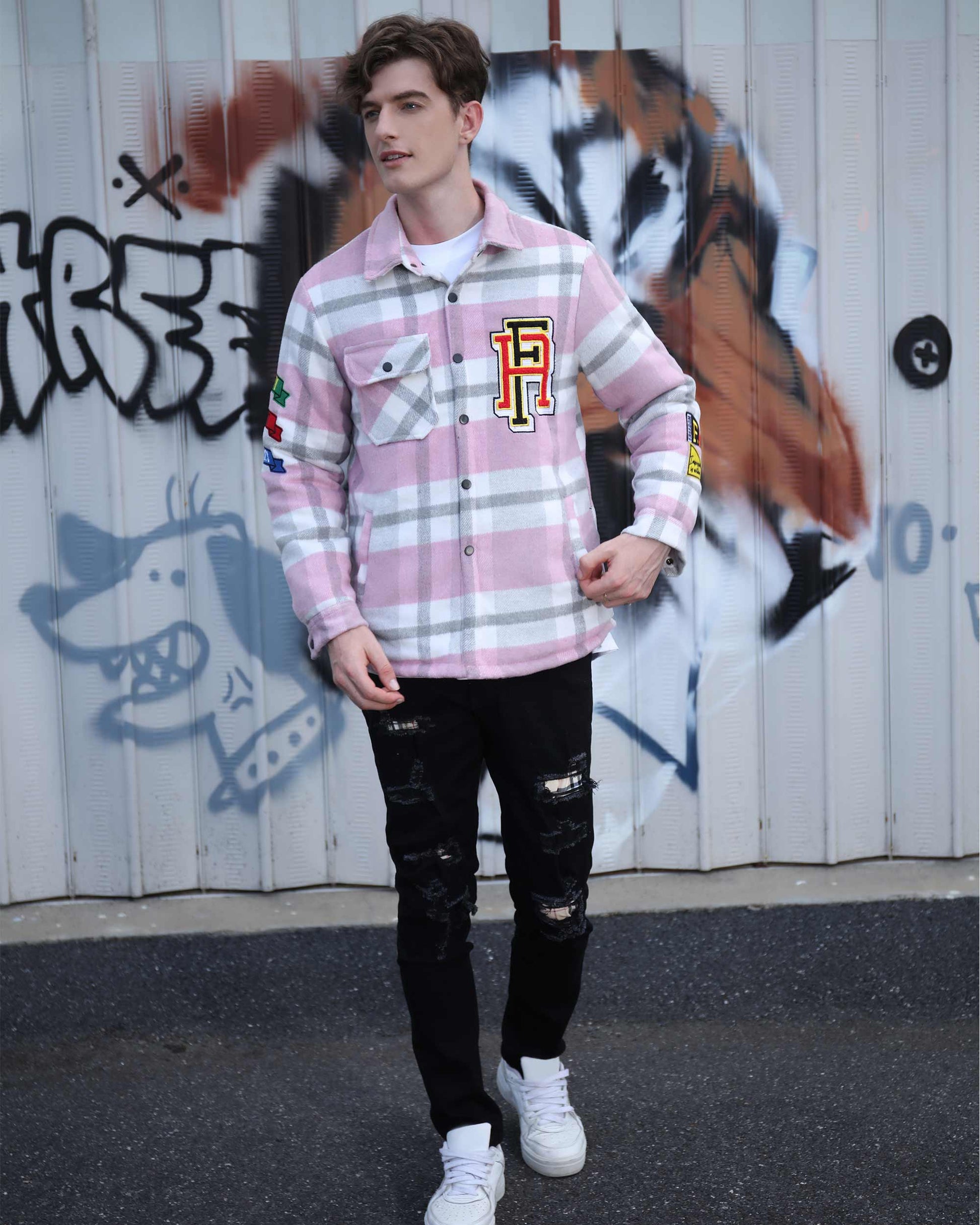 Logeqi modern plaid moto jacket in pink and white worn by male model with black ripped jeans