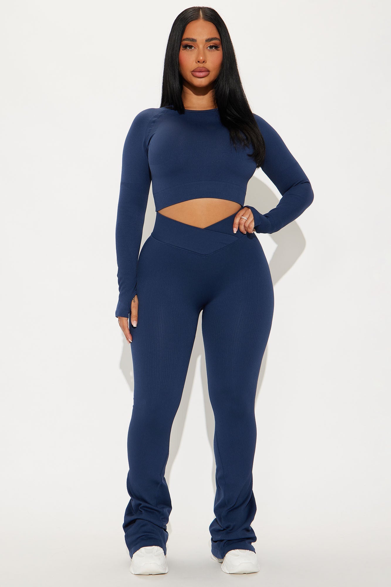 Fashion Nova navy active yoga pants for women paired with a matching long-sleeve crop top