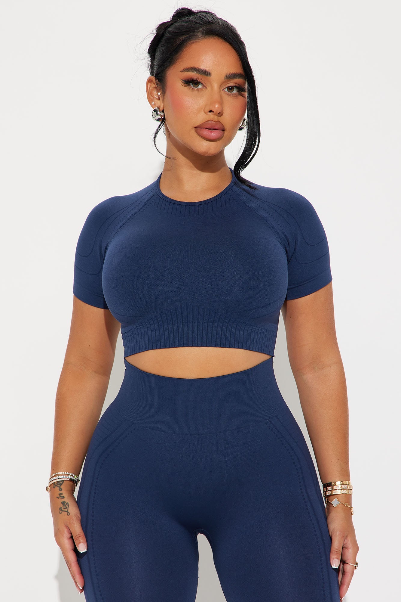 Navy blue activewear set for women featuring a cropped top and high-waisted leggings