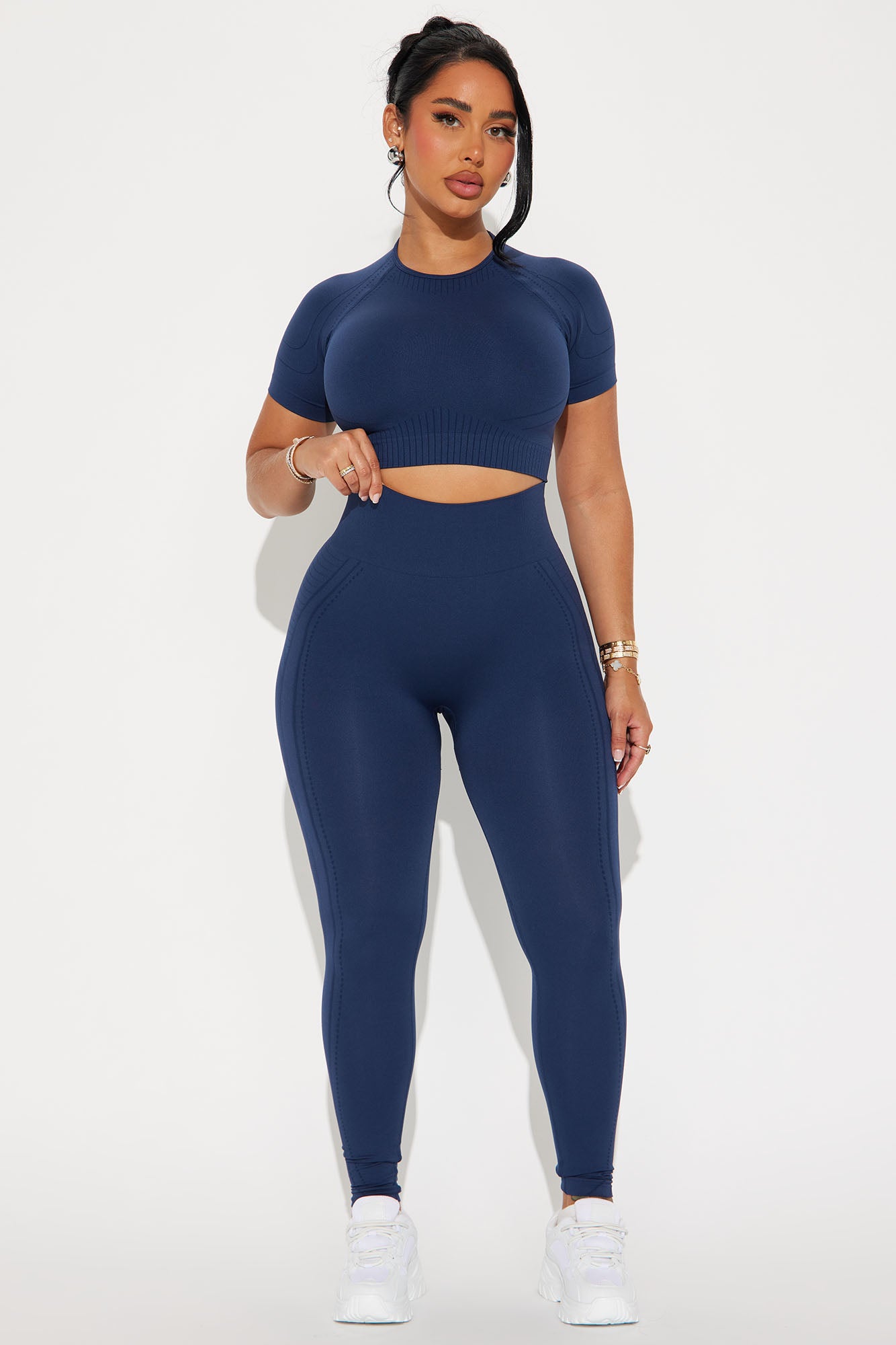 Navy blue activewear set for women featuring a cropped top and high-waisted leggings