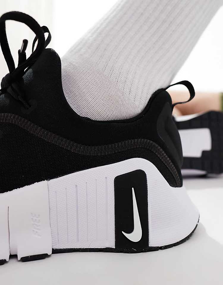 Close-up of Nike Free Metcon 6 black white sneakers showcasing the sleek design and comfortable fit