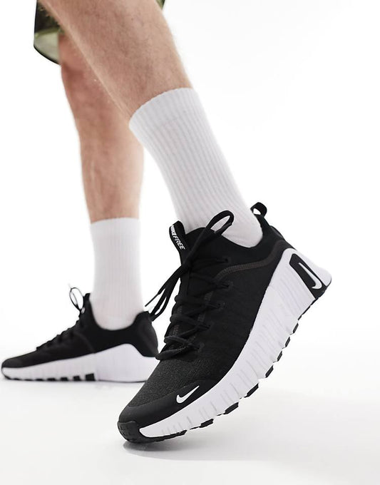 Nike Free Metcon 6 black white sneakers showcasing a sleek design and flexible sole for versatile workouts