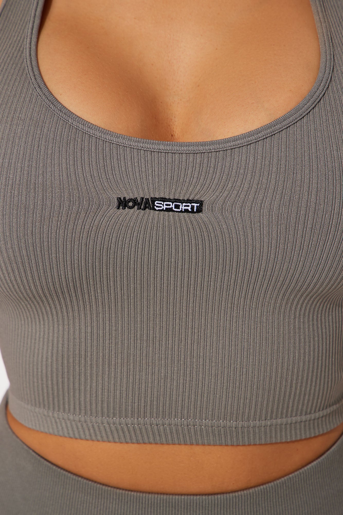 Close-up of seamless active top charcoal by Nova Sport featuring a stylish ribbed design