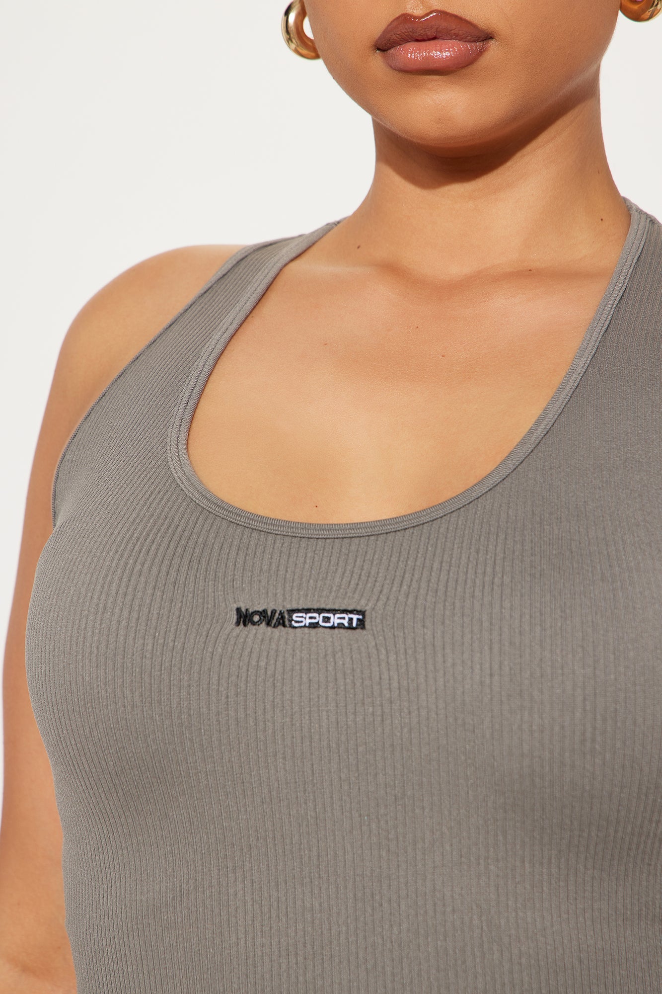 Seamless active top charcoal by Fashion Nova with ribbed texture and logo detail