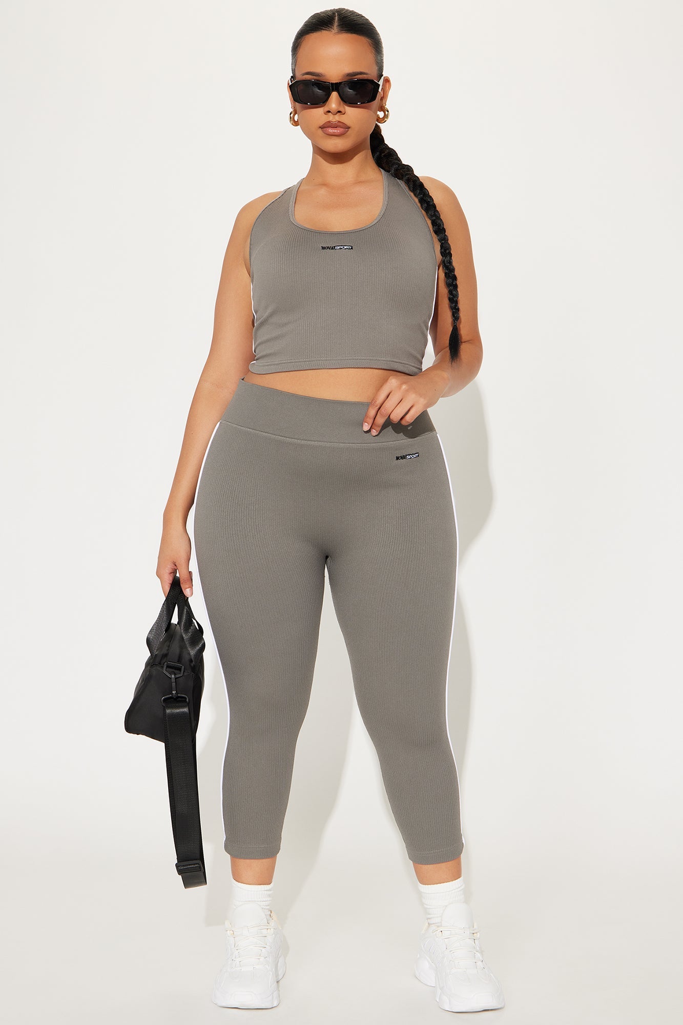 Fashion Nova seamless capri leggings for women in gray paired with a matching sports bra