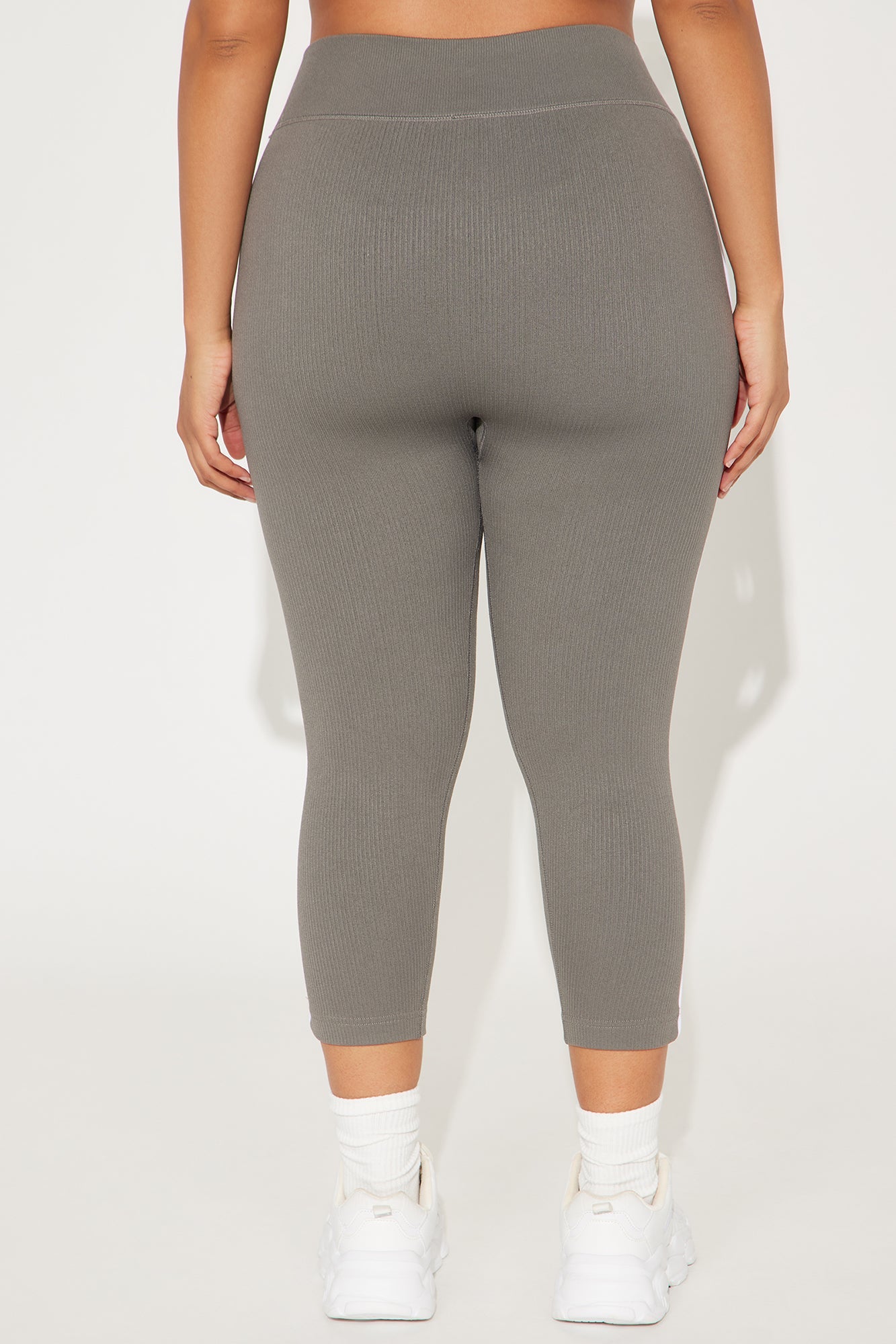 Women wearing gray seamless capri leggings for women, designed for comfort and style.