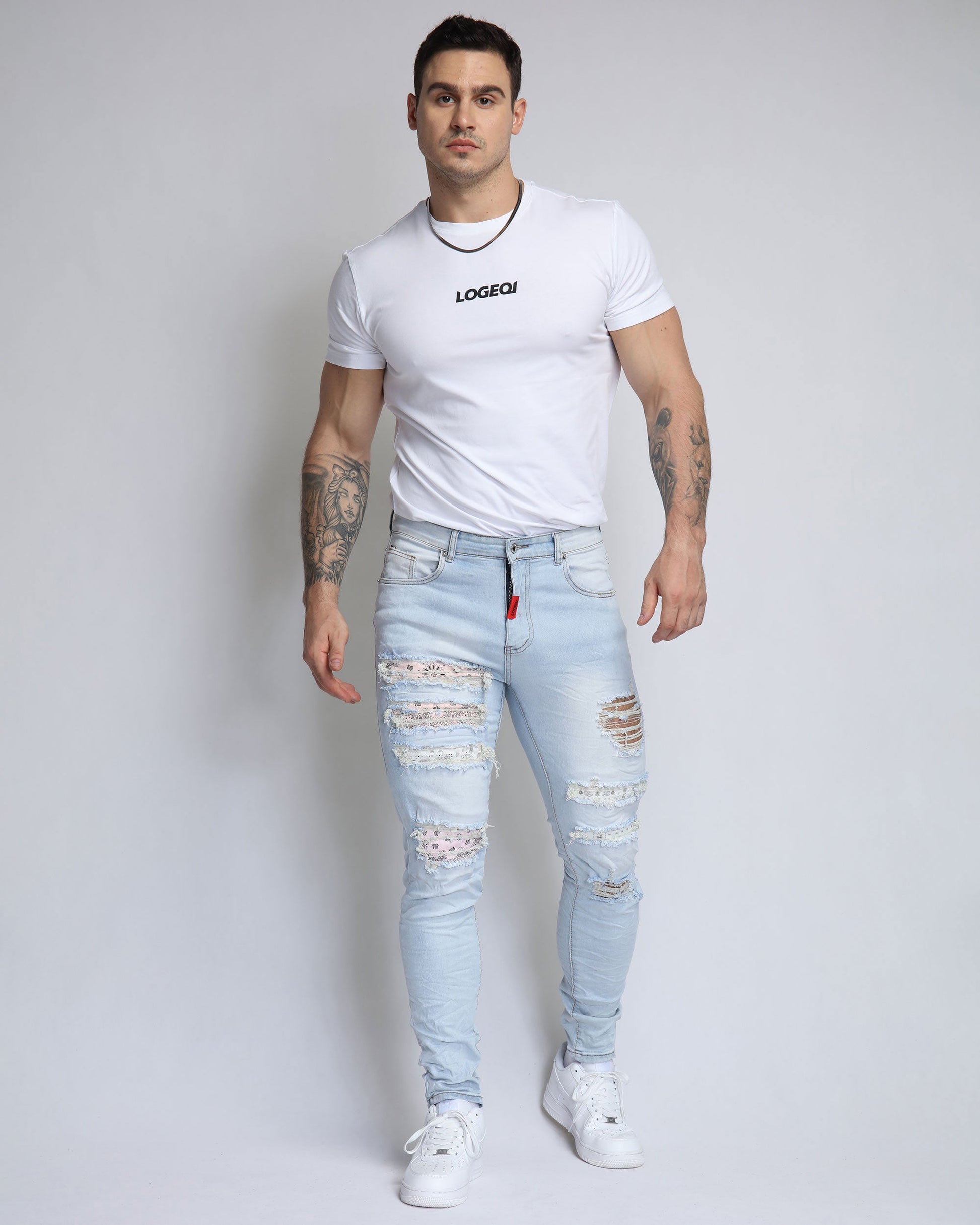 Logeqi pink cashew blossom jeans with distressed detailing and slim fit design