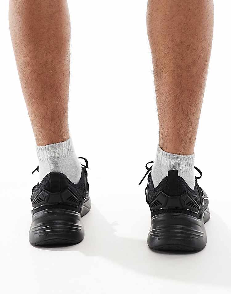 Rear view of PUMA Retaliate 3 black sneakers showing sleek design and comfortable fit