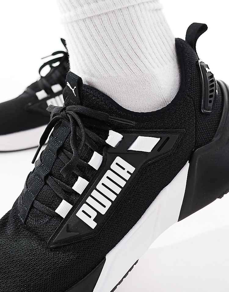 PUMA Retaliate 3 black sneakers with breathable mesh upper and cushioned sole for comfort
