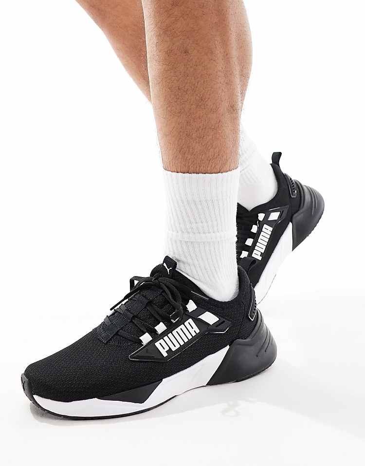 PUMA Retaliate 3 black sneakers with stylish design and comfortable fit for active lifestyles