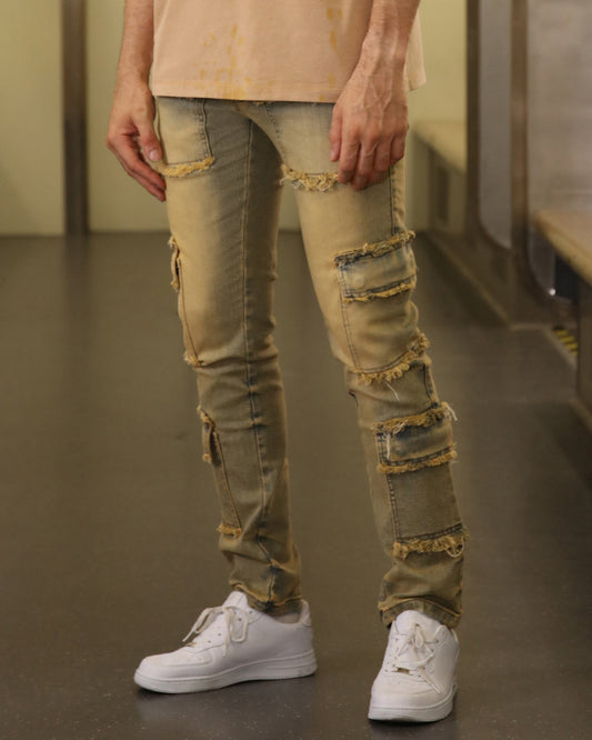 Logeqi raw edge brown jeans with multiple distressed patches and cargo-style pockets
