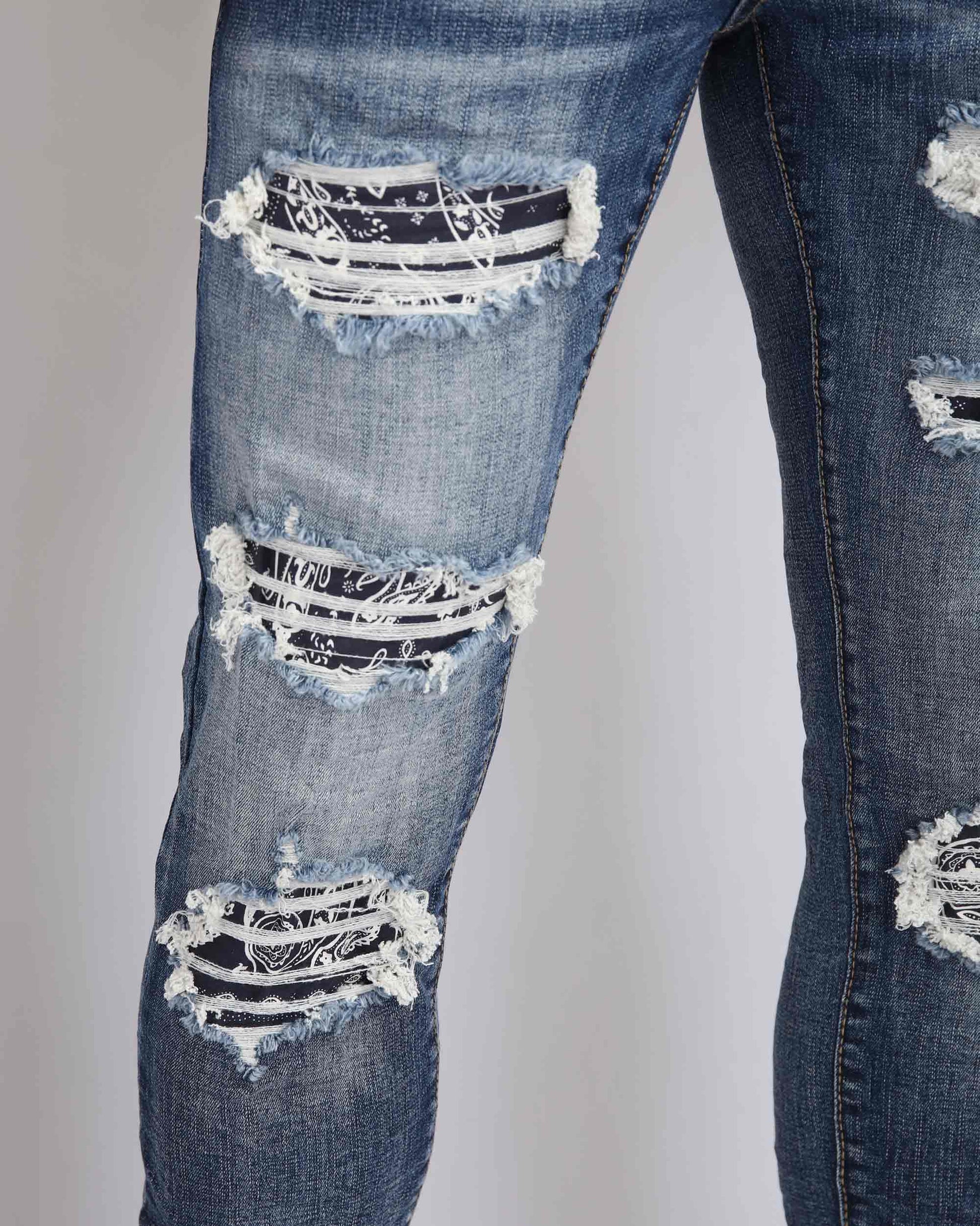 Logeqi ripped blue jeans with flower patch featuring distressed details and stylish design