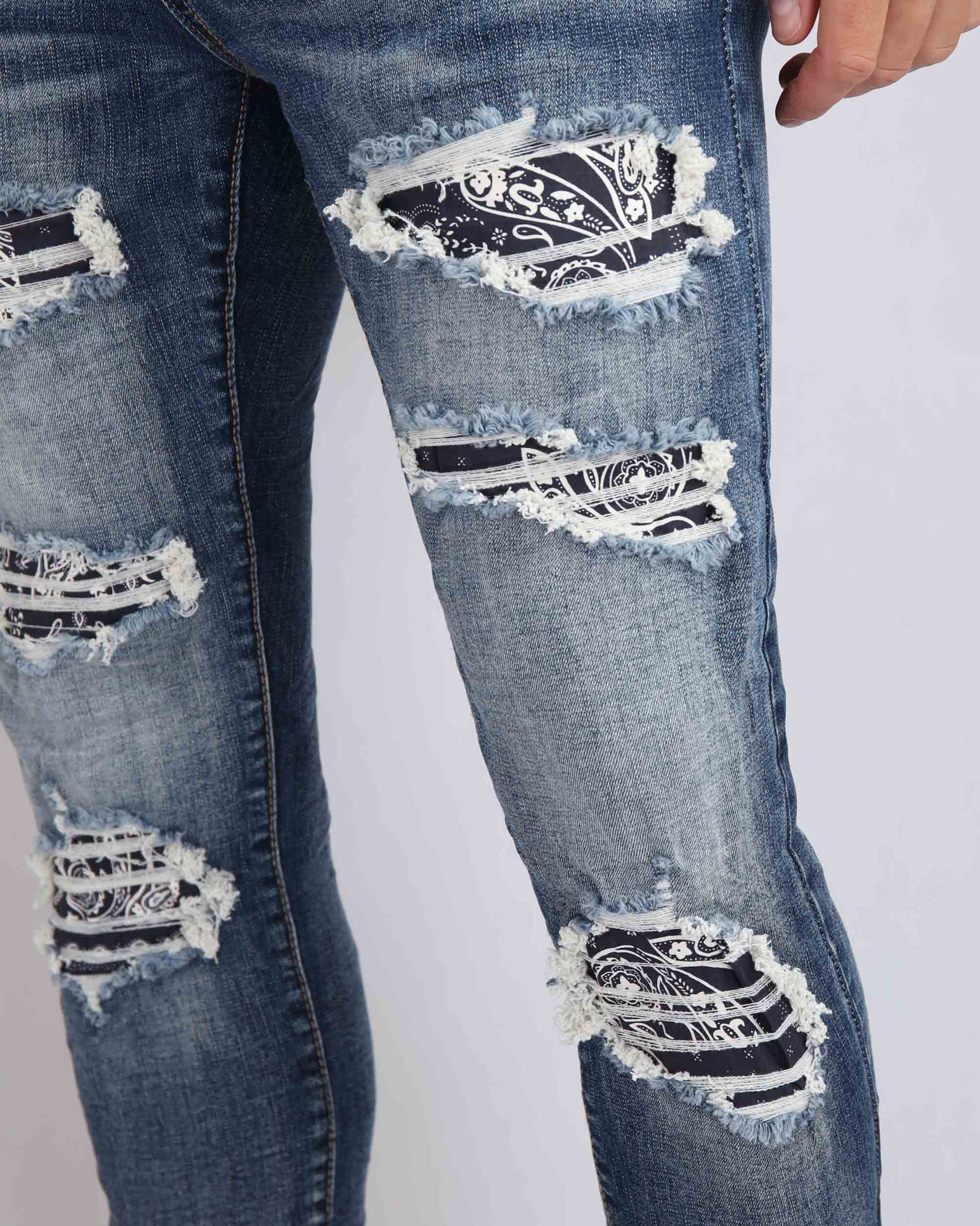 Logeqi ripped blue jeans with flower patch showcasing distressed details and stylish design