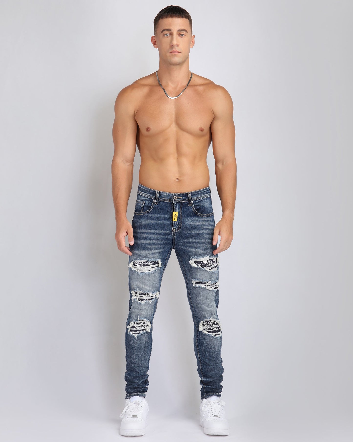 Logeqi ripped blue jeans with flower patch featuring a stylish distressed design