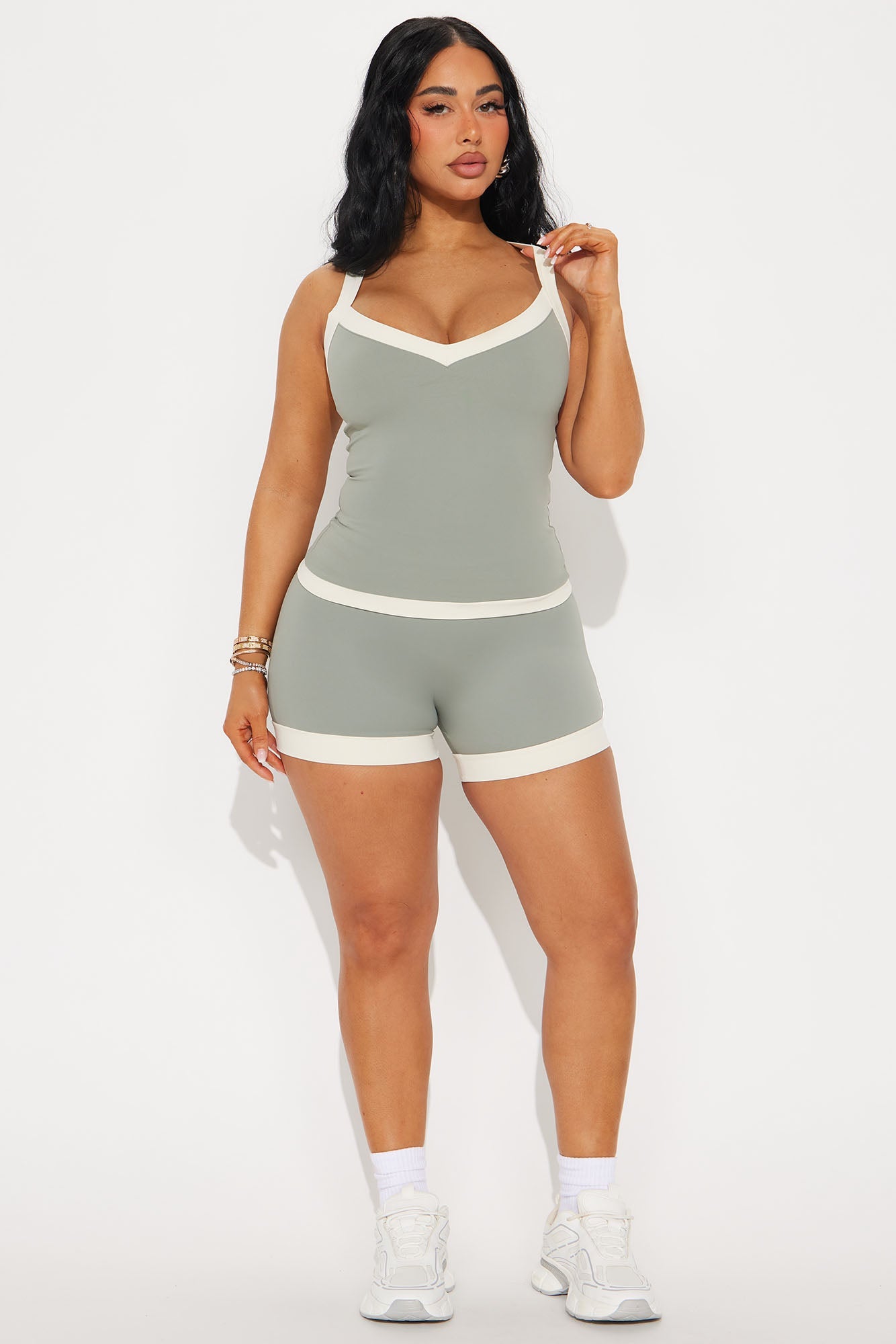 Sage green active tank top paired with matching shorts for a stylish workout outfit