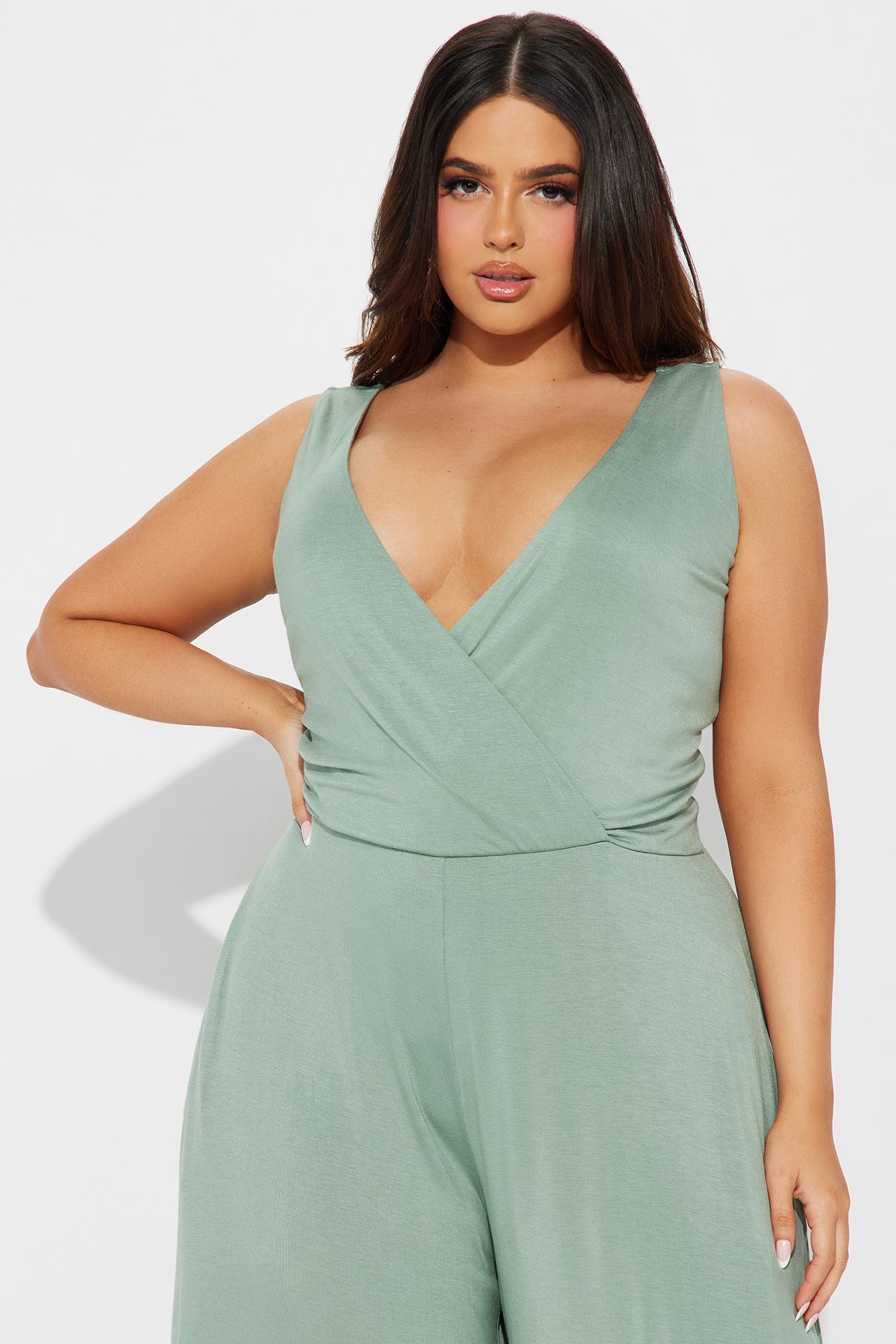 Fashion Nova sage green jumpsuit for women with a wrap design and stylish deep V neckline