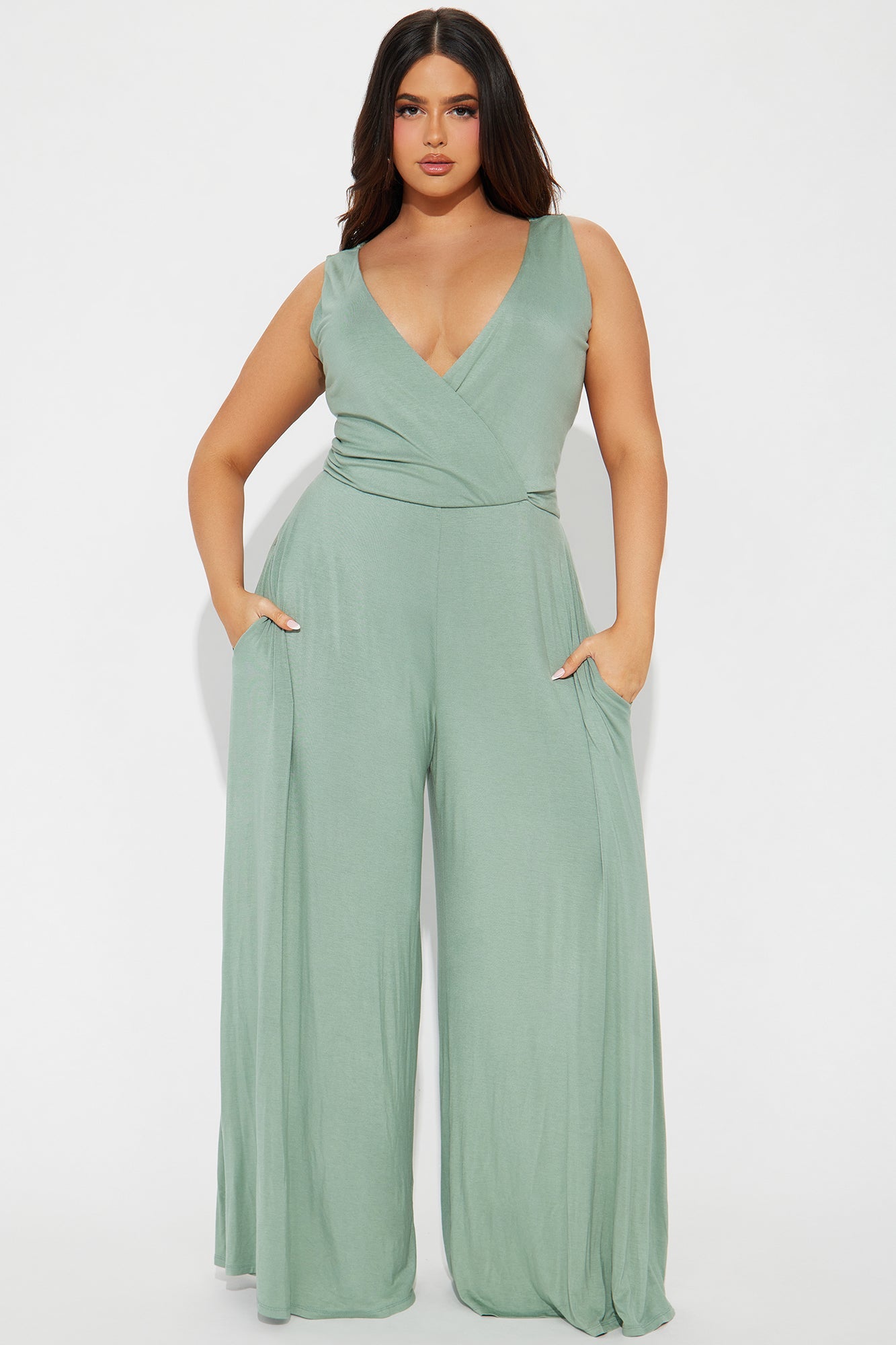 Sage green jumpsuit for women featuring a wrap design and pockets for a stylish look