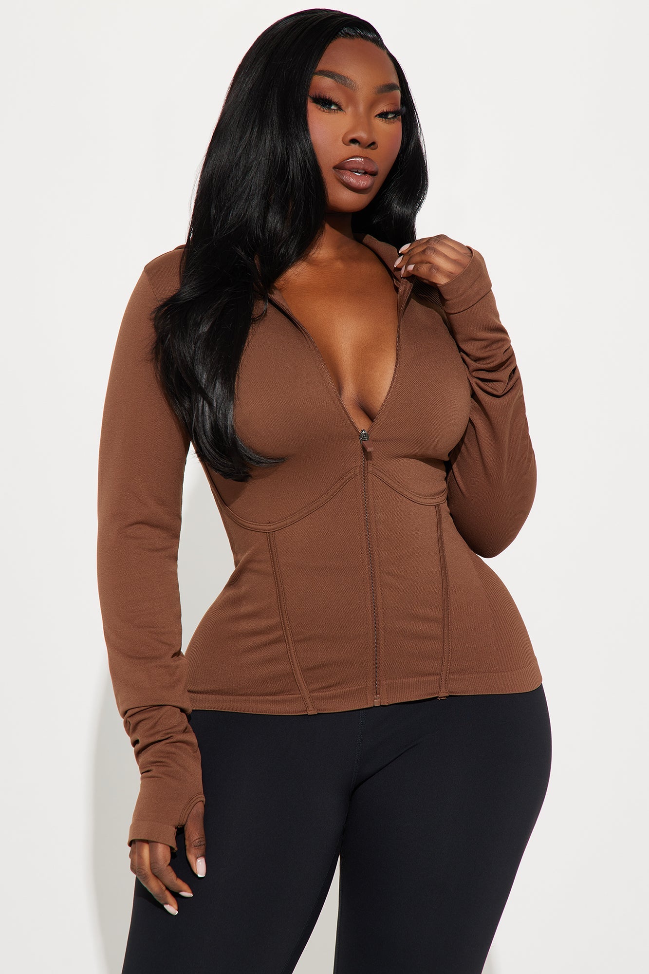 Brown seamless active jacket for women with zip front and fitted design from Fashion Nova
