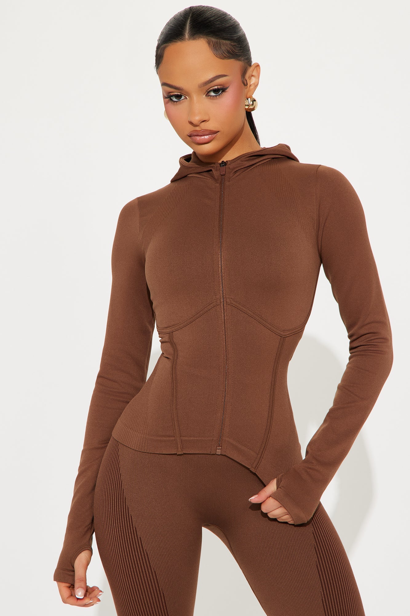 Brown seamless active jacket for women with a hood and form-fitting design from Fashion Nova