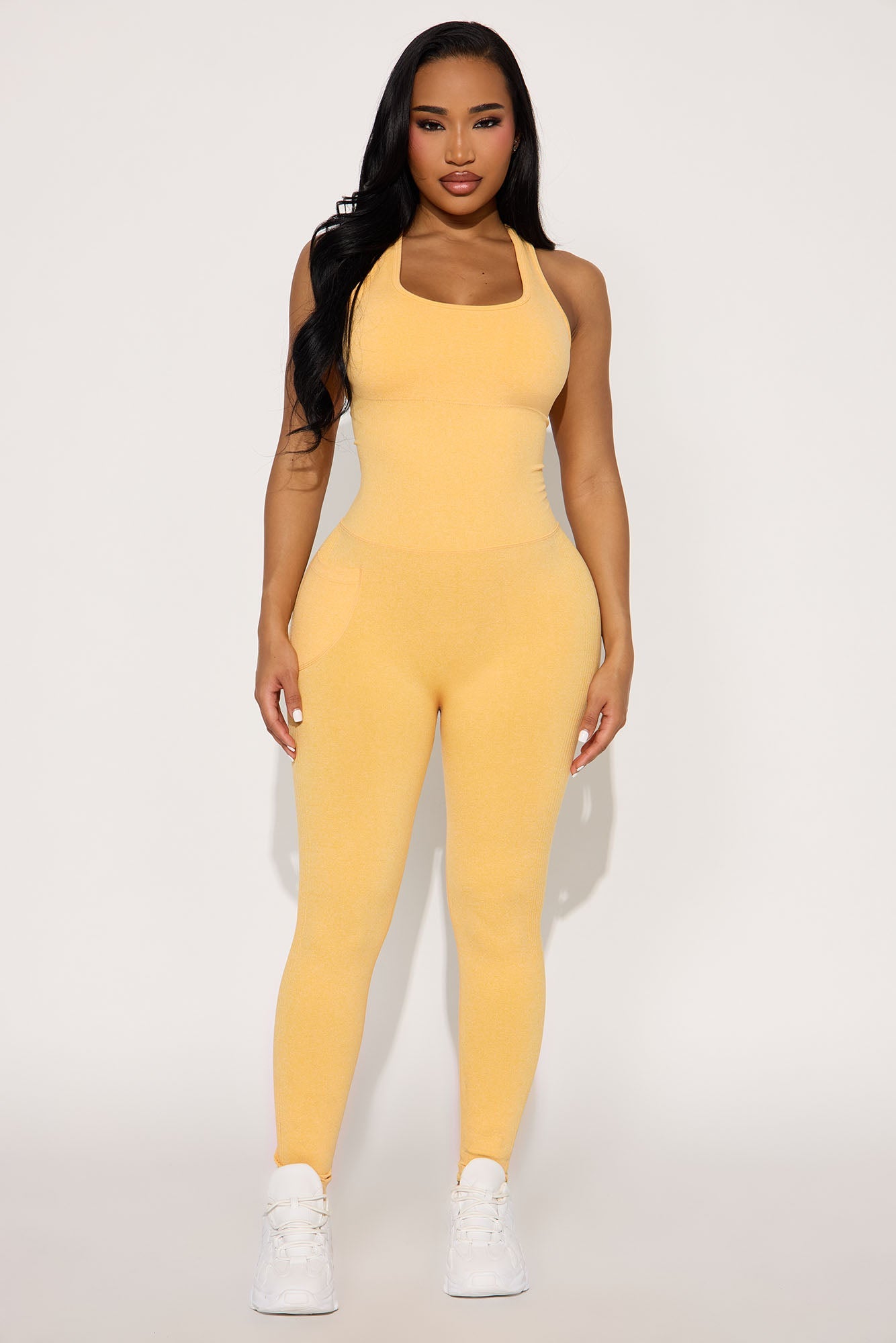 Fashion Nova seamless active jumpsuit orange with form-fitting design for workout or casual wear