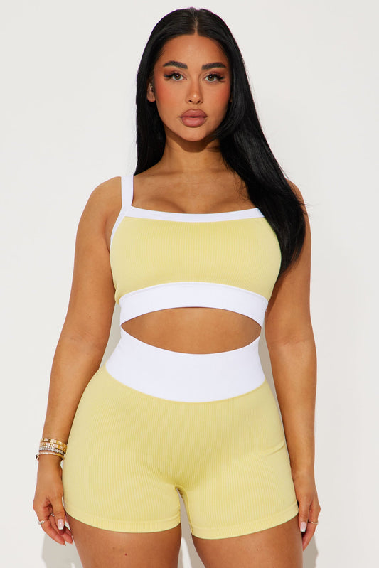 Nova Sport seamless ribbed sports bra in yellow with white accents and stylish cut-out design