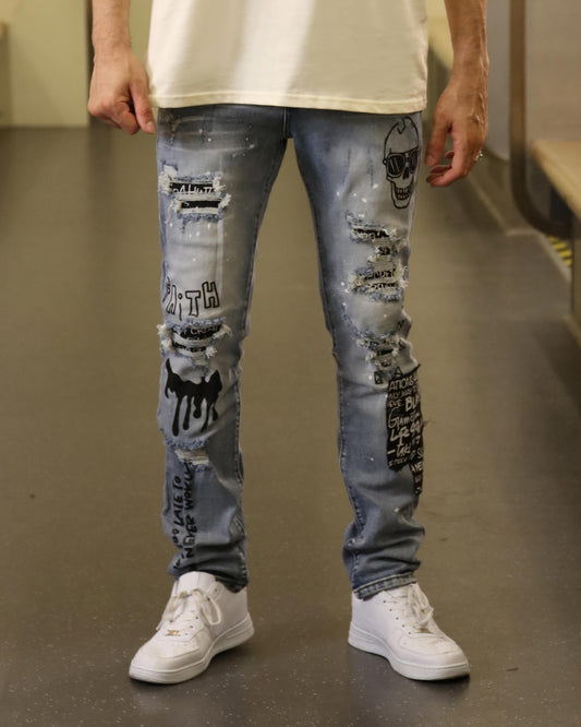 Logeqi skull graffiti ripped jeans with distressed details and graphic prints on light blue denim