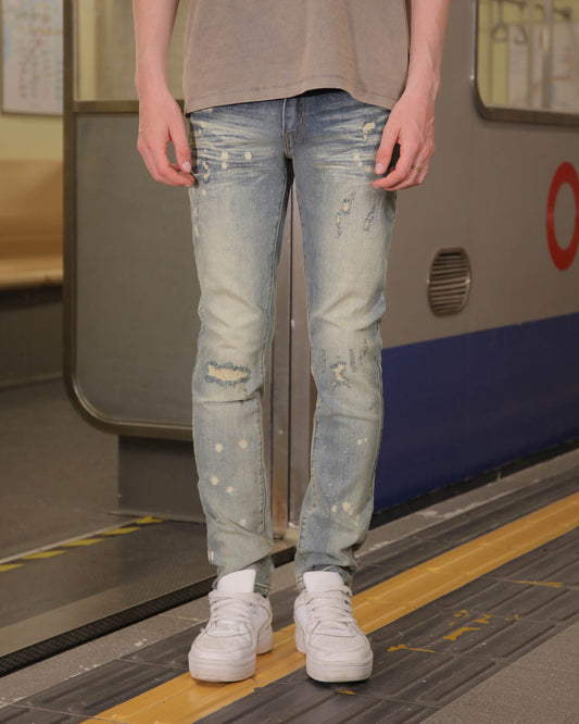 Logeqi slim fit distressed jeans in light blue with stylish rips and a modern look