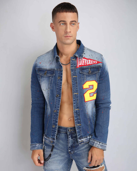 Trendy spray paint denim jacket by Logeqi featuring bold patches and a stylish fit