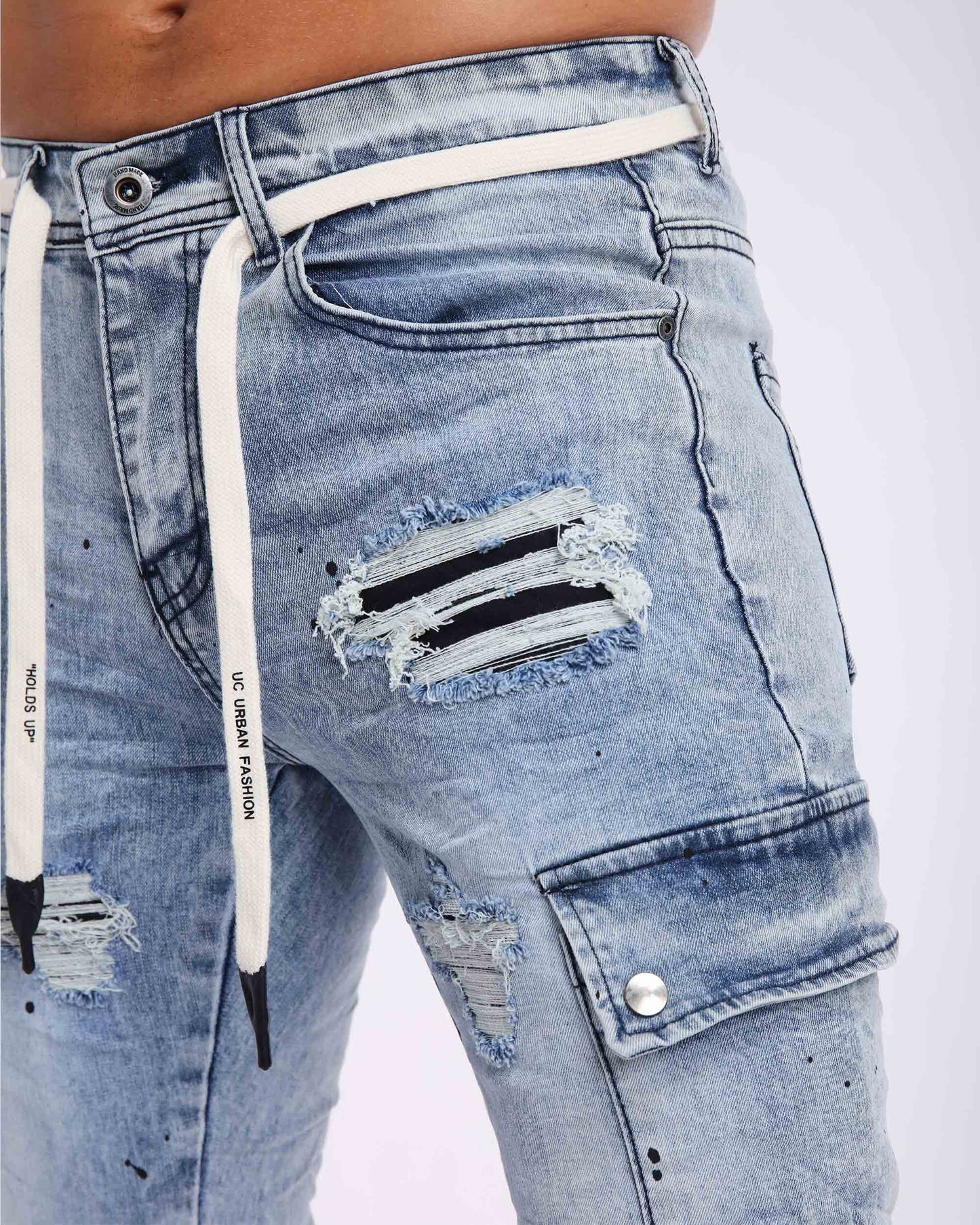 Logeqi spray paint ripped jeans with distressed detailing and drawstring waistband for a trendy look