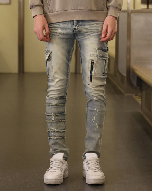 Logeqi spray painted blue cargo jeans with distressed details and zipper pockets
