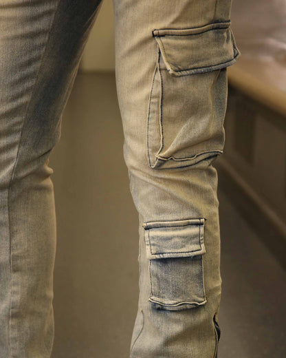 Close-up of Logeqi spray painted blue cargo jeans showing detailed side pockets and stitching