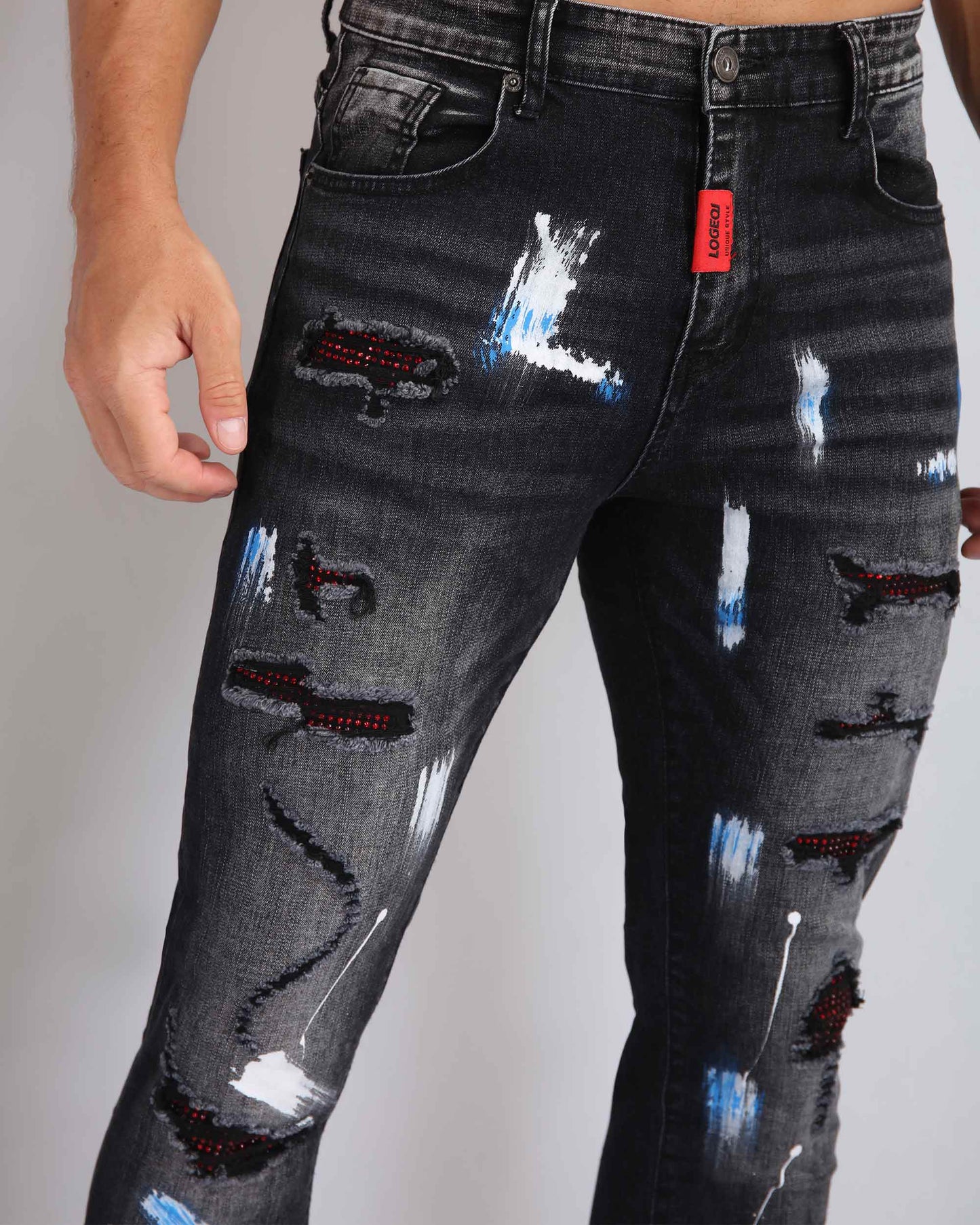 Logeqi street art jeans featuring distressed detailing and colorful paint splatters for a trendy look