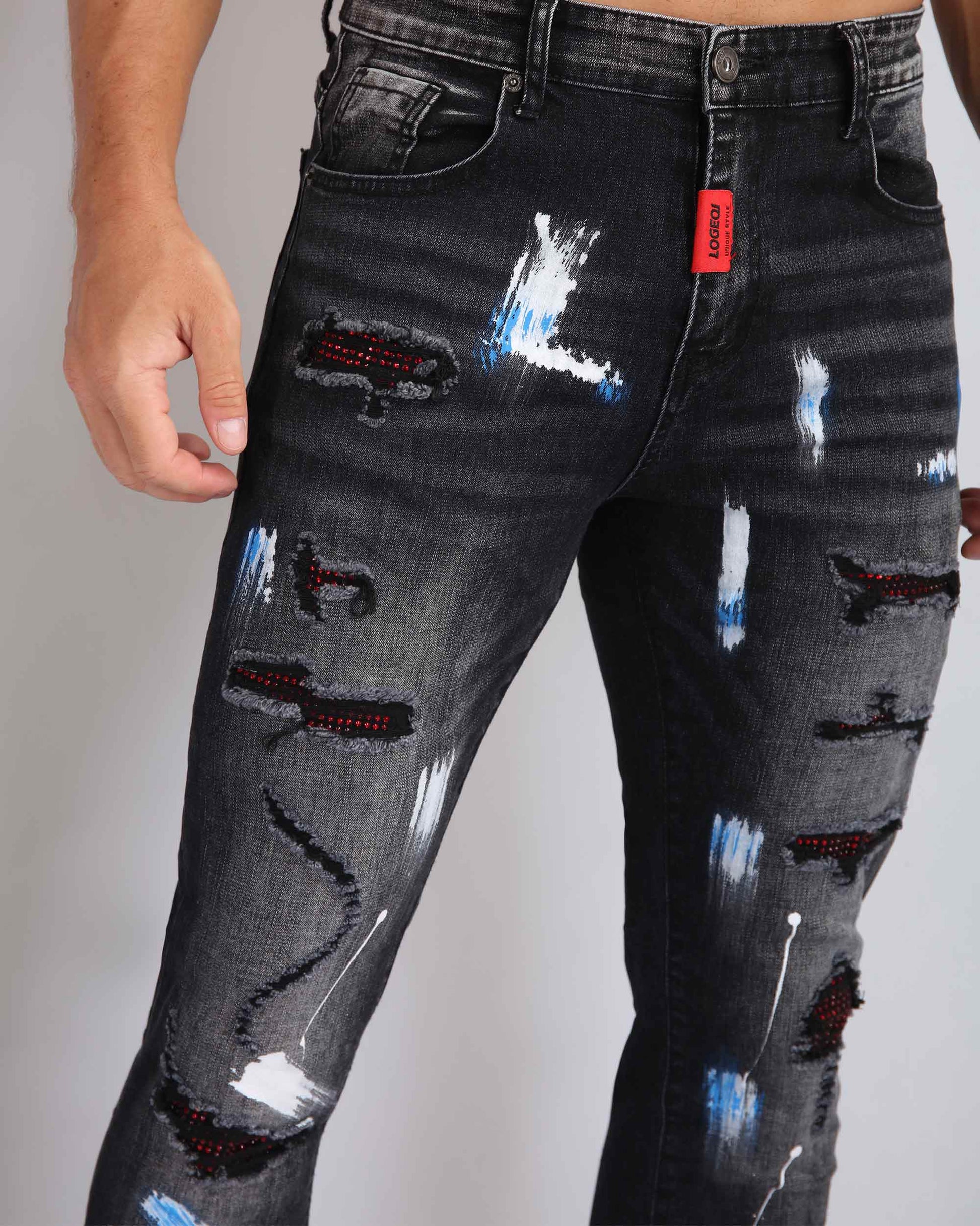 Logeqi street art jeans featuring distressed detailing and colorful paint splatters for a trendy look