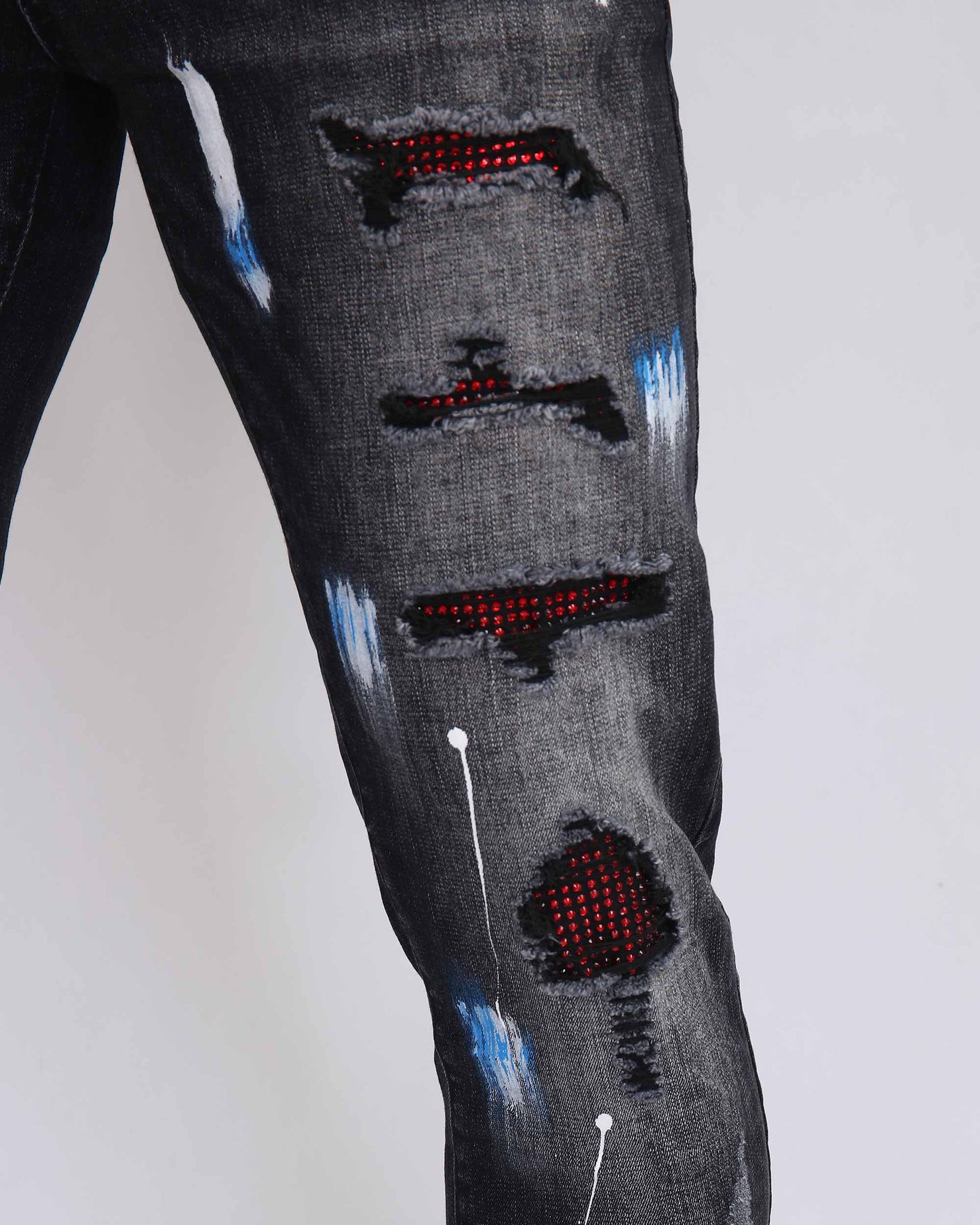 Logeqi street art jeans with distressed detailing and vibrant spray paint effects
