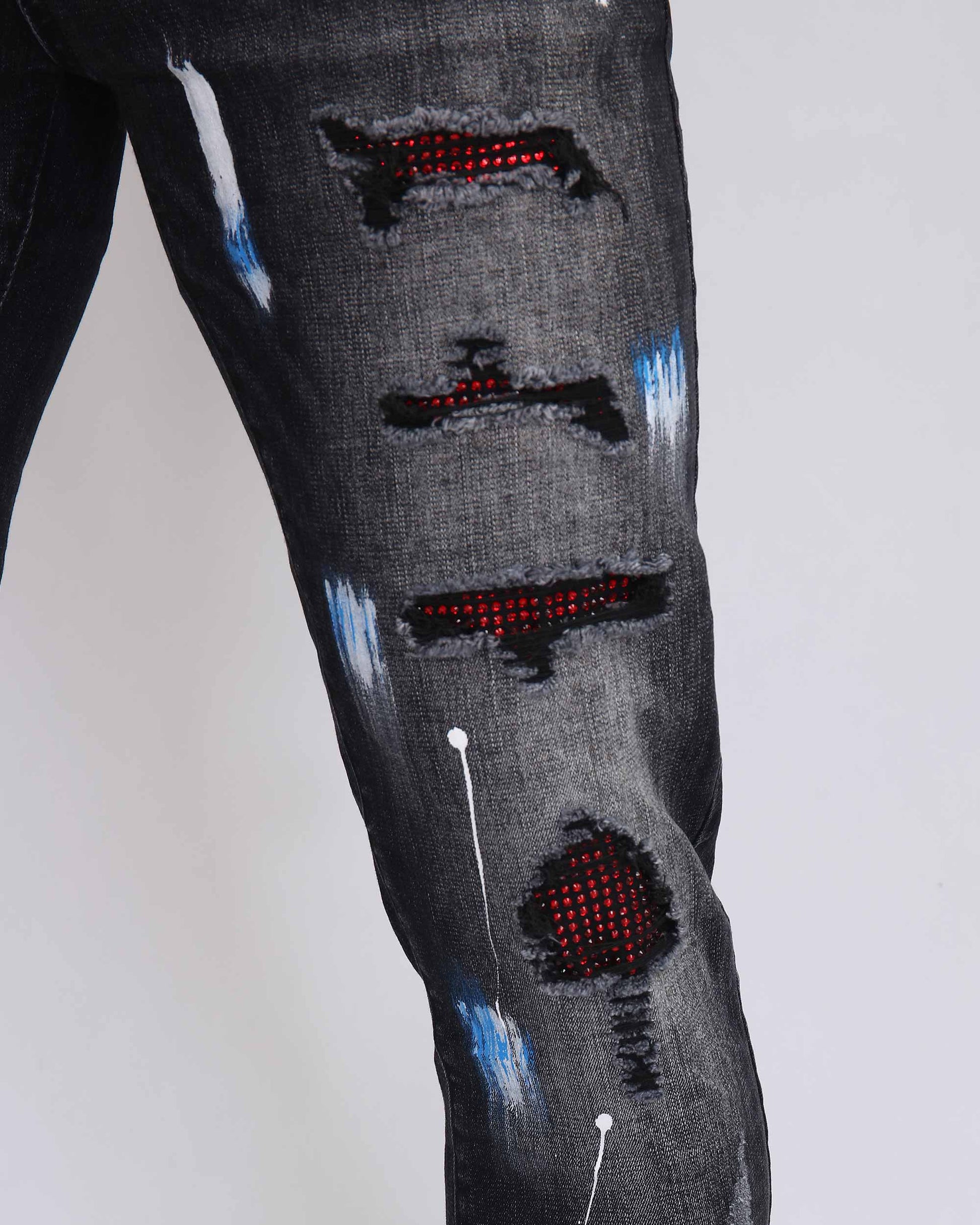 Logeqi street art jeans with distressed detailing and vibrant spray paint effects