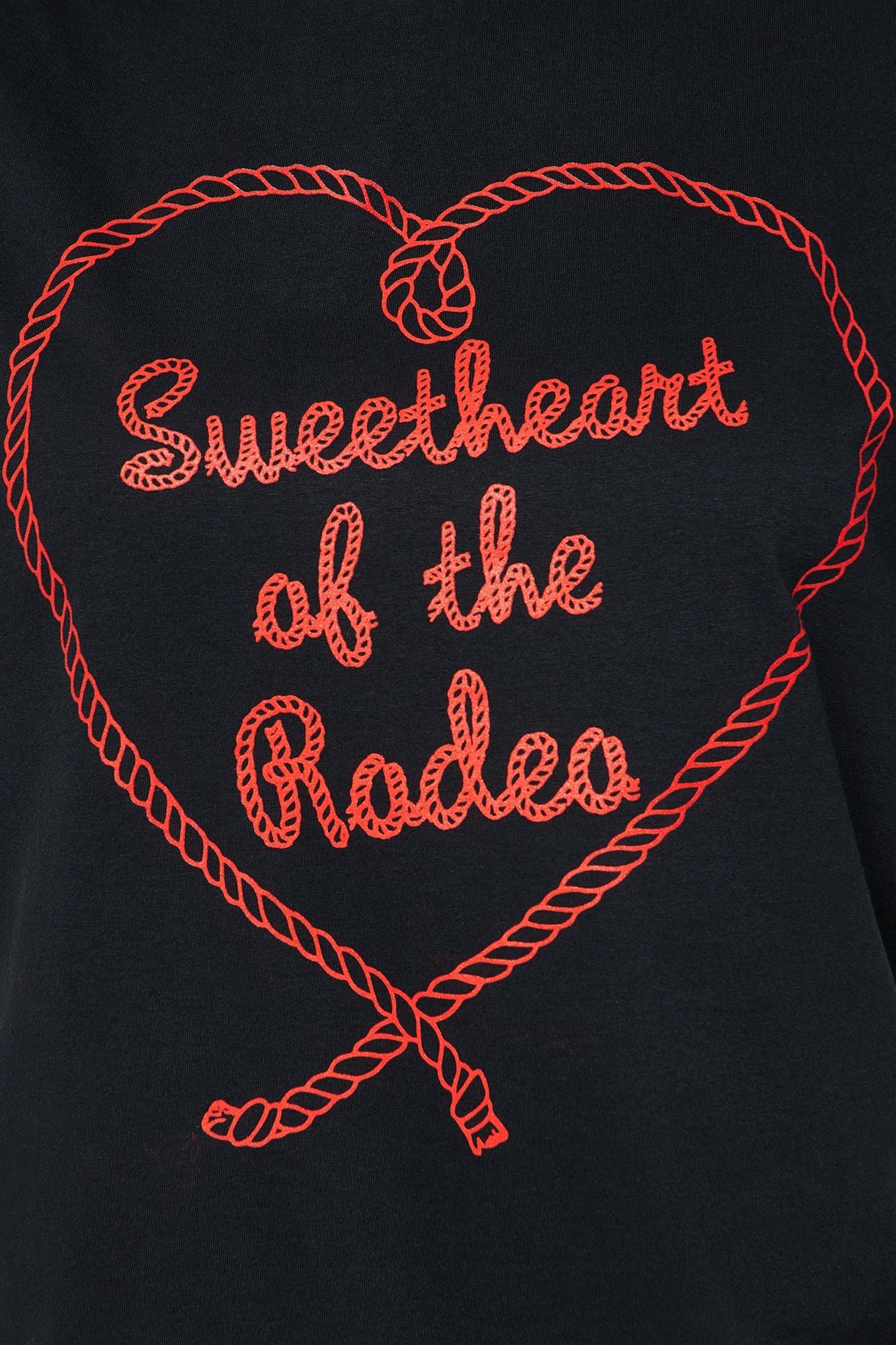 Fashion Nova Sweetheart Rodeo oversized tee with stylish heart graphic design in red stitching