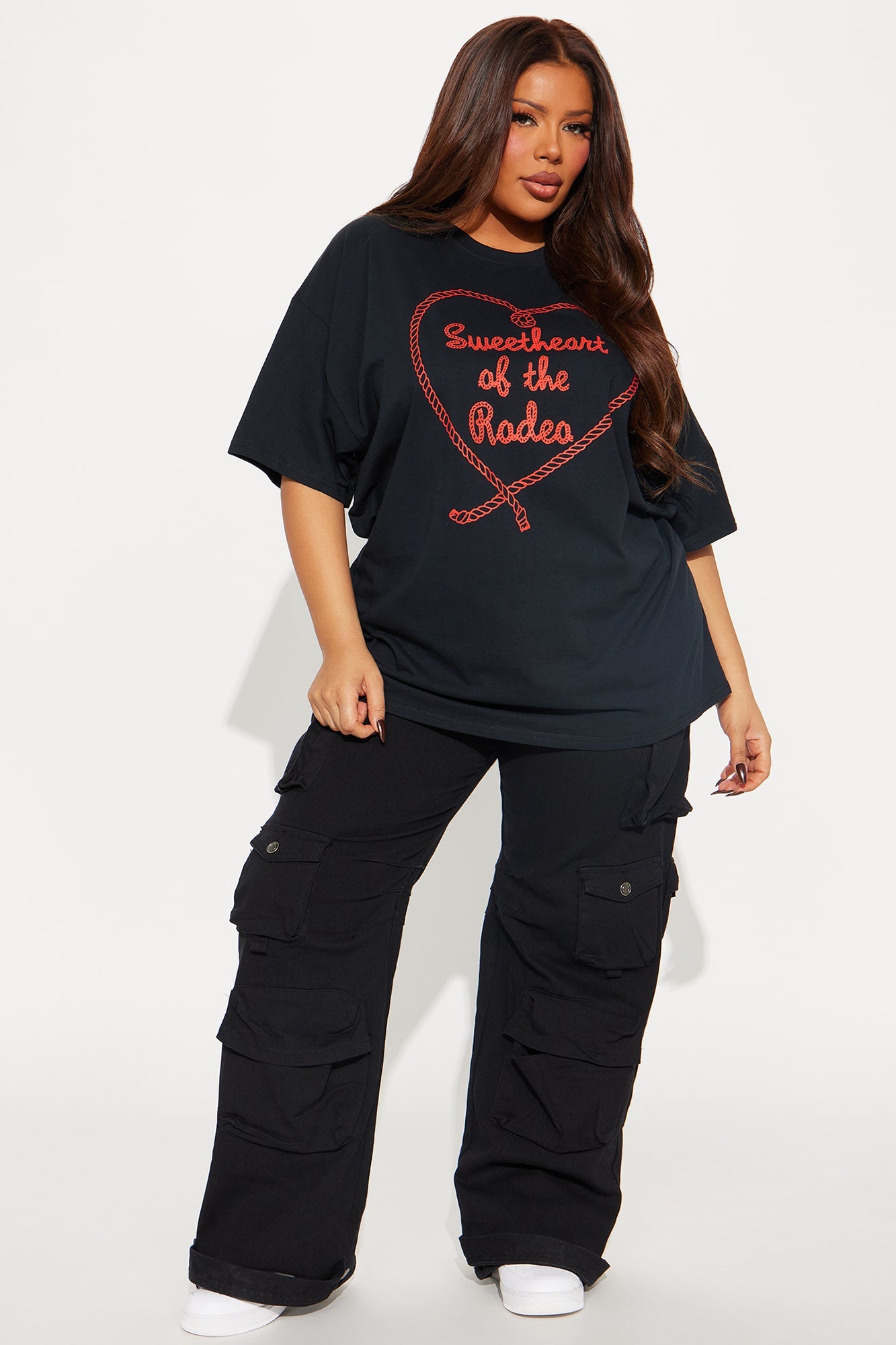 Fashion Nova Sweetheart Rodeo oversized tee in black paired with cargo pants for a stylish casual look