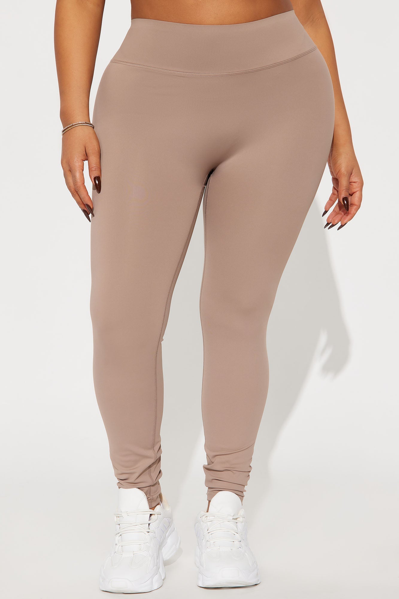 Fashion Nova taupe active leggings for women with a high waistband and stretchy fabric