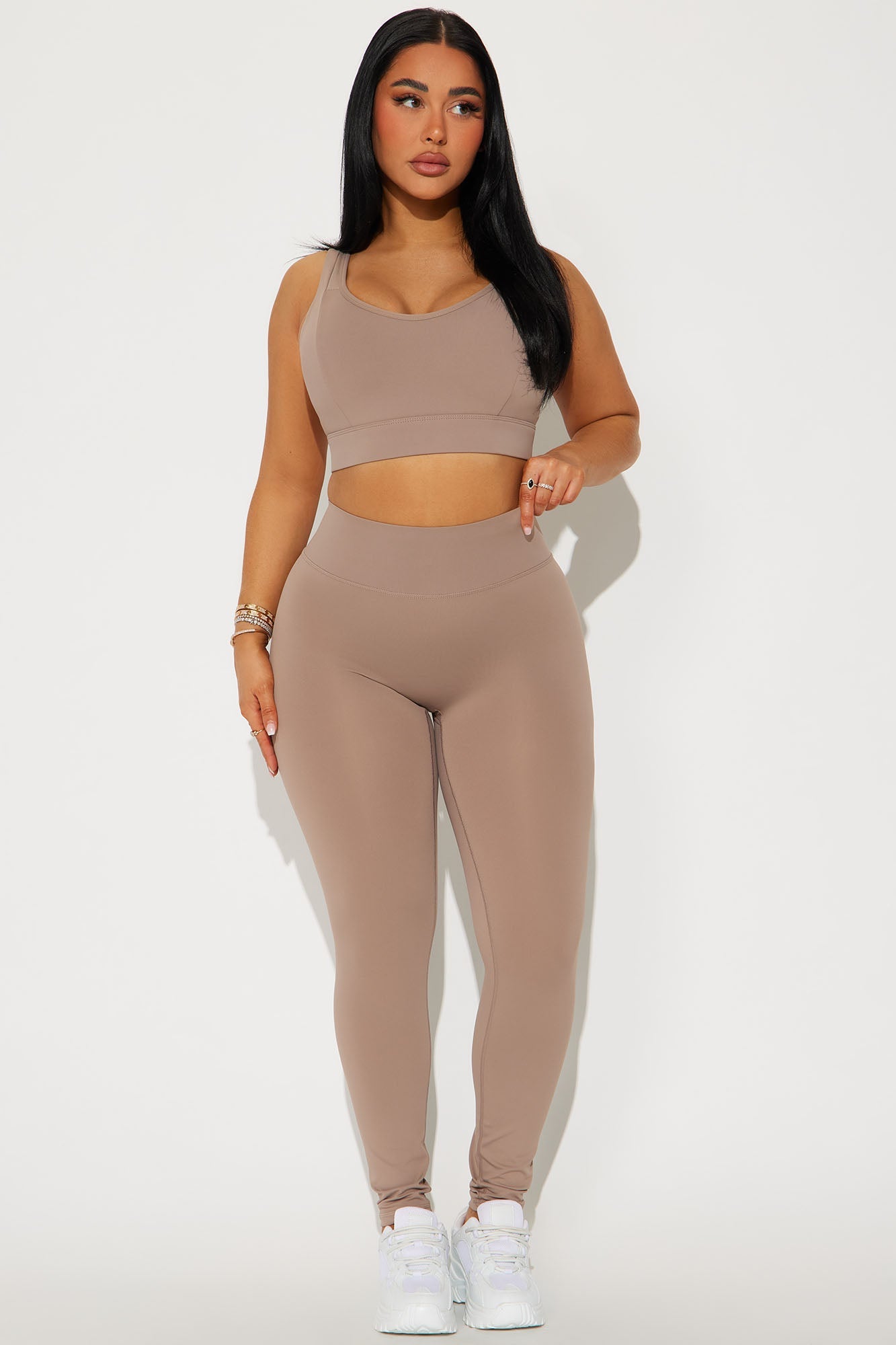 Fashion Nova taupe active leggings for women paired with a matching sports bra for a stylish look