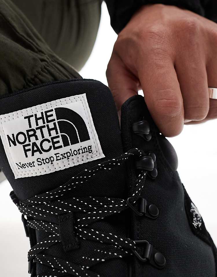 Close-up of The North Face Back-To-Berkeley IV waterproof hiking boots being laced up for outdoor adventures